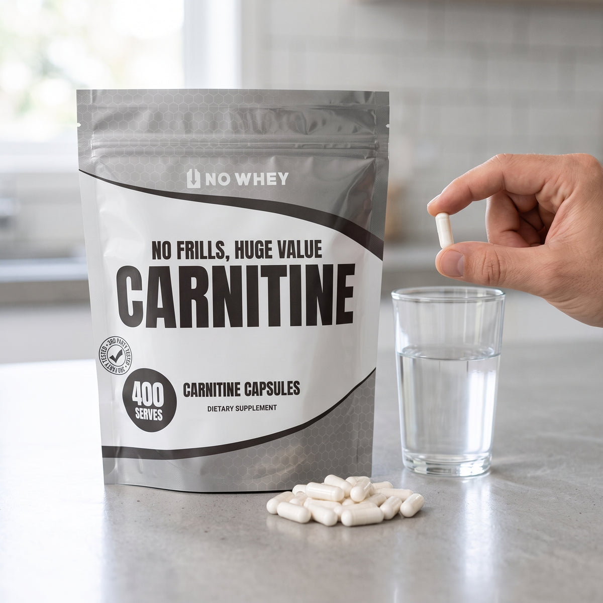 NoWhey Carnitine 400 Capsules - capsules and a glass of water on a kitchen counter