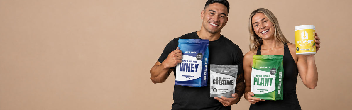Two NoWhey athletes holding whey, creatine, plant protein and pre-workout